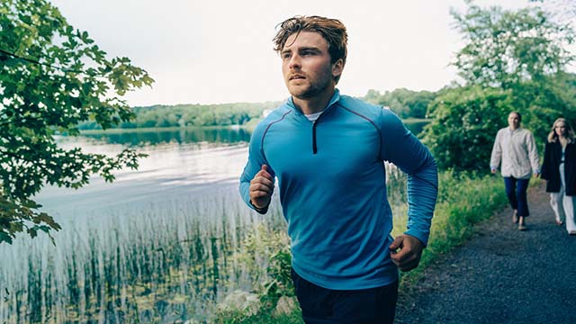 A man running in nature - Small