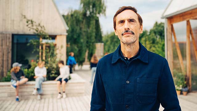 Older man looking at house - Small